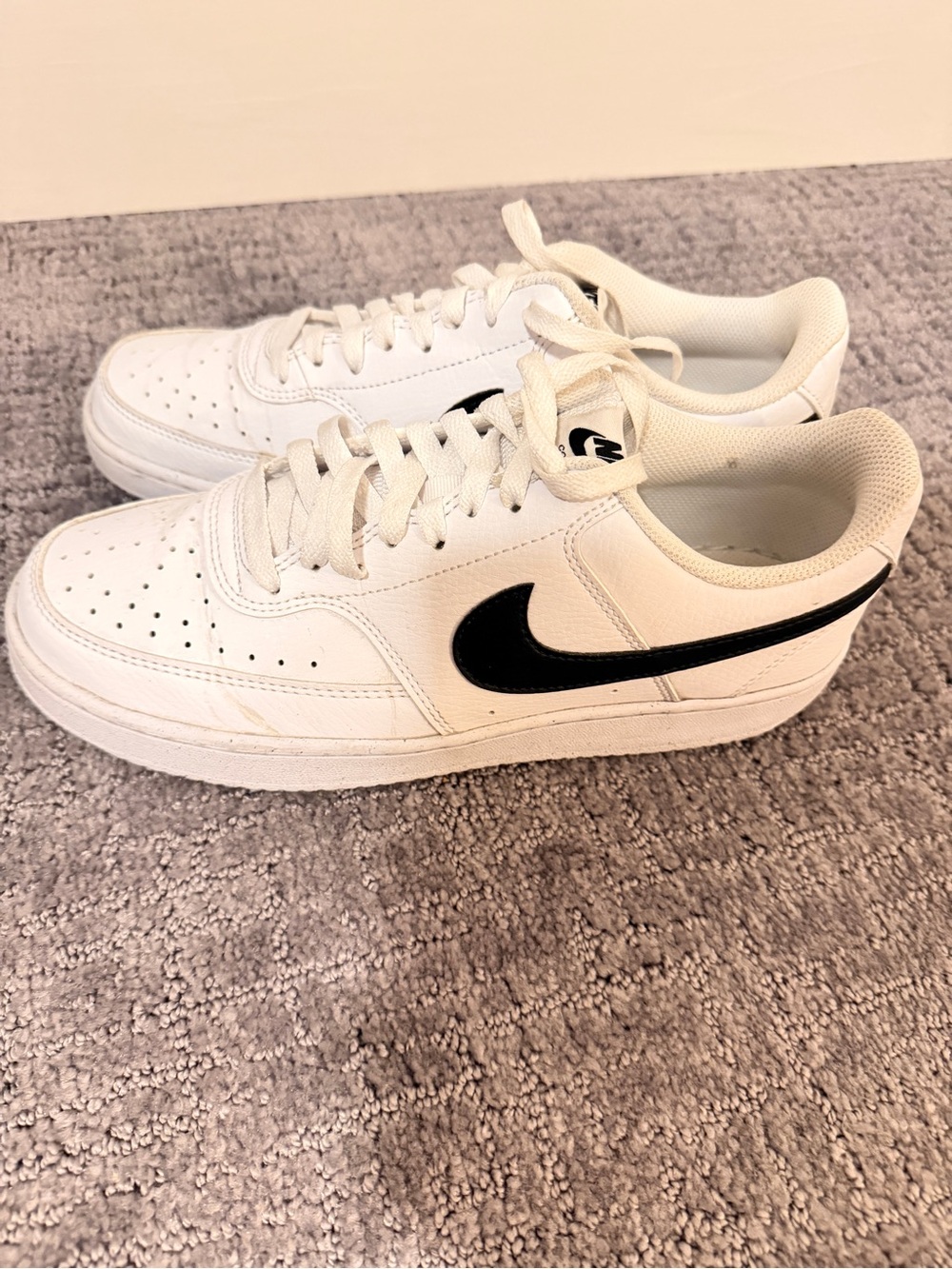 Nike White Low-Top Sneakers with Black Swoosh